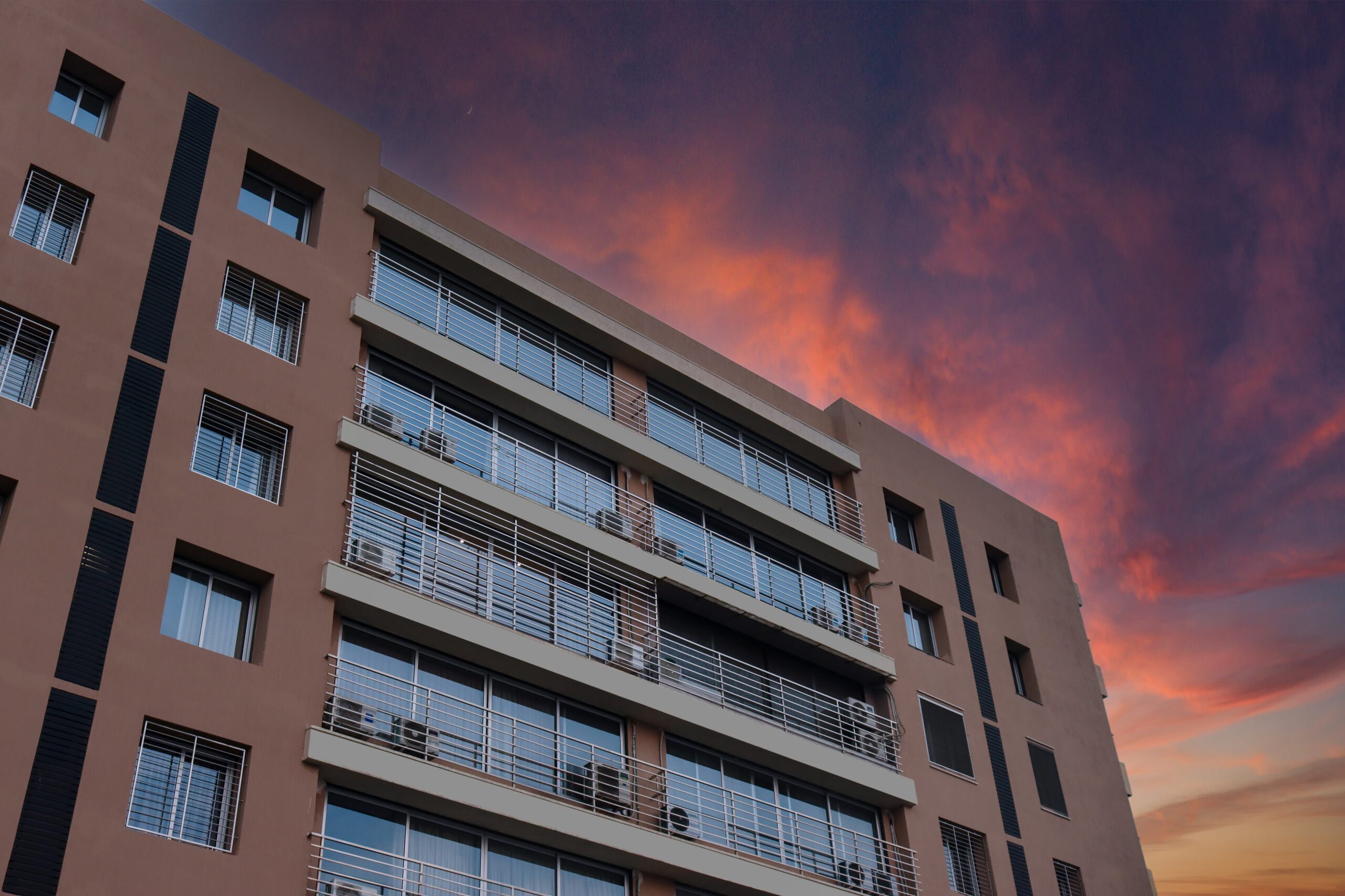 Low Angle Shot Of Residential Building With Dramatic Sky