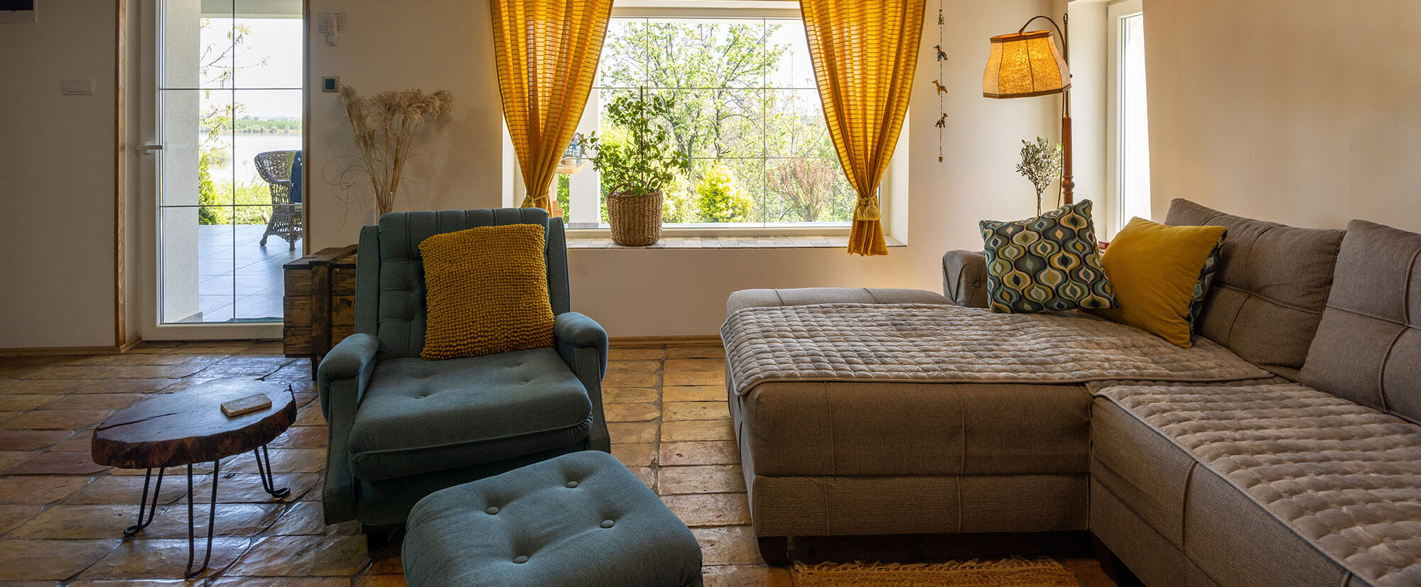 Rustic interior of a cozy rental cabin room with a floor made of old tiles