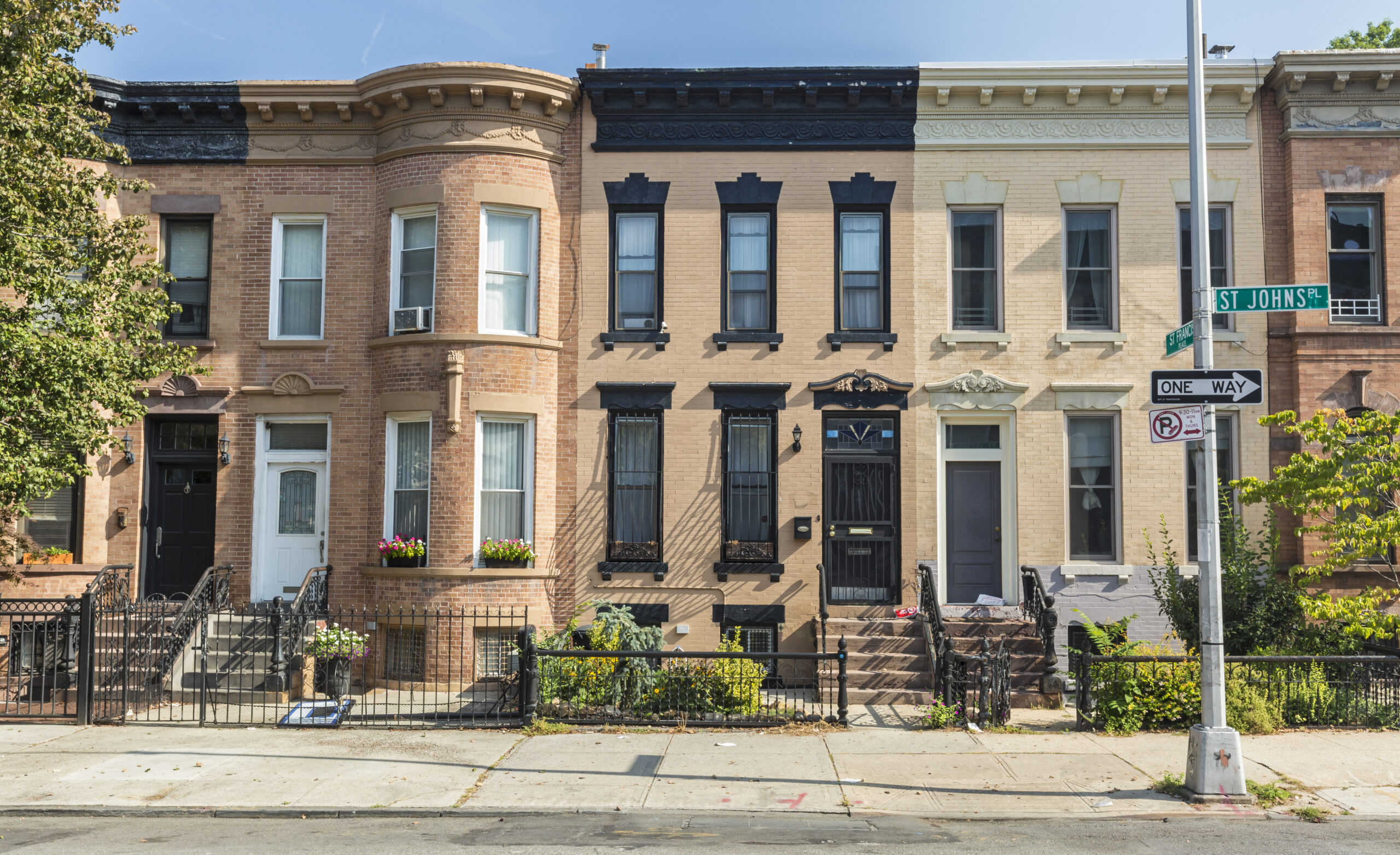 A Row Of Brick Apartment Buildings
